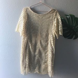 Gold net like dress.